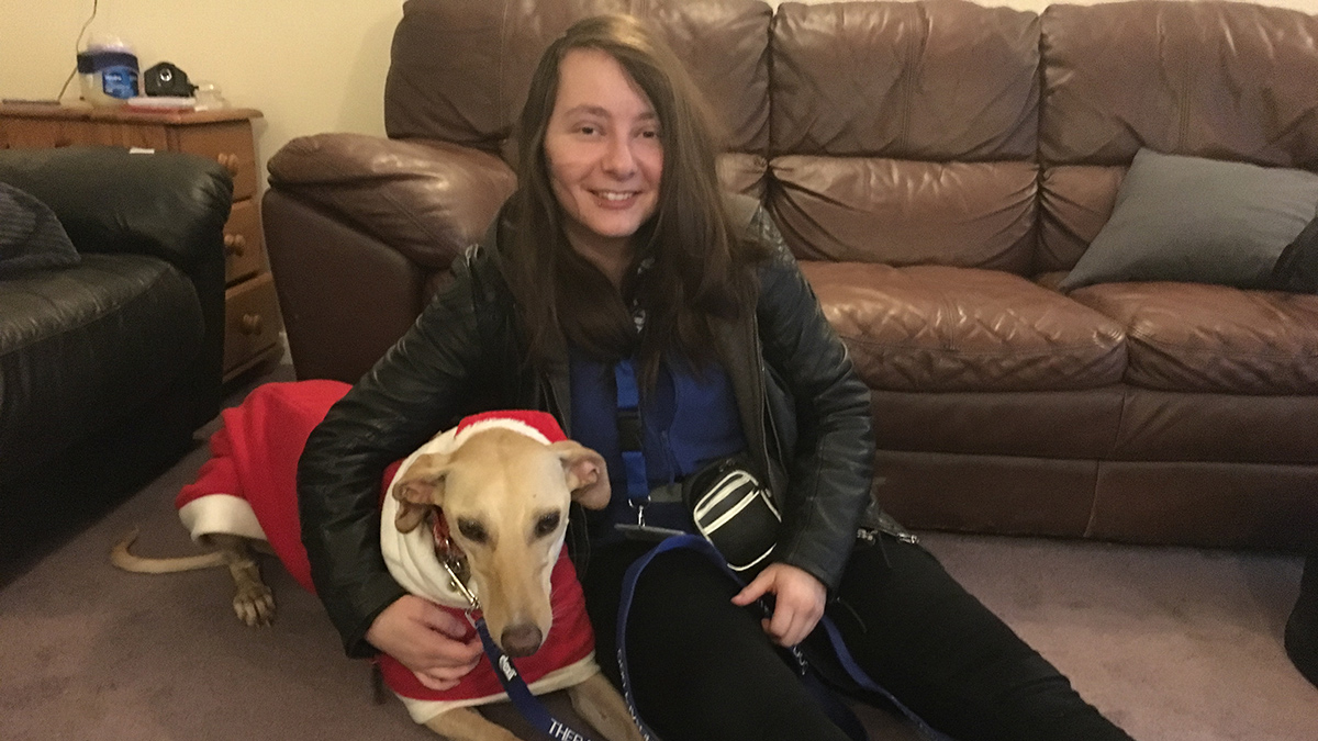 Carrie with Turkey the lurcher dog at Christmas